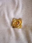 Gold square gem set swirl 